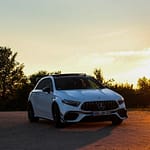 Mercedes-AMG A 45 S weiß Frontansicht bei Sonnenuntergang auf Landstraße